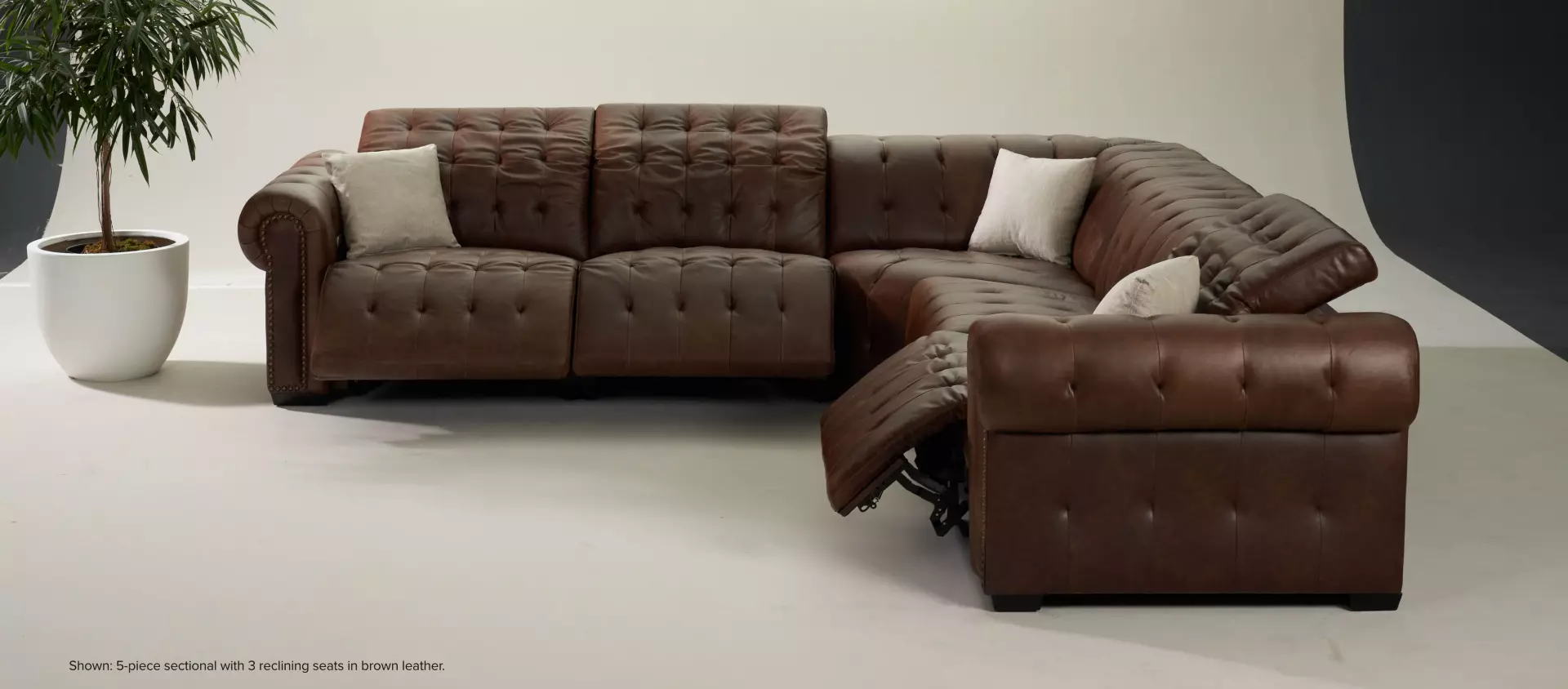 Windsor Park 5-piece sectional with 3 reclining seats in brown leather.